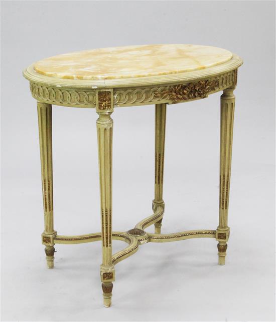 A French cream painted and parcel gilt oval Louis XVI style centre table, W.2ft 7in.